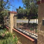 Wrought Iron Infill fencing with scrolls at base